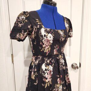 Cute ruched mini dress with skulls and roses pattern. Size 4 from Disturbia
